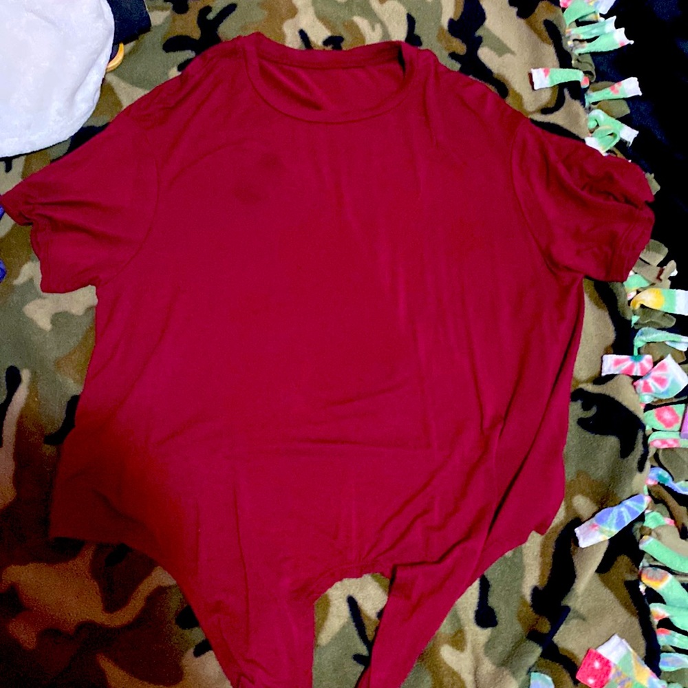 Dark red crop top. With tie on bottom of shirt. Never worn